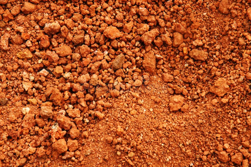 Red earth or soil background. Tropical laterite soil or red earth background.