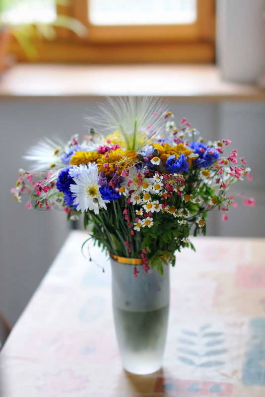 2286223-vase-of-wild-flowers-on-table.jpg