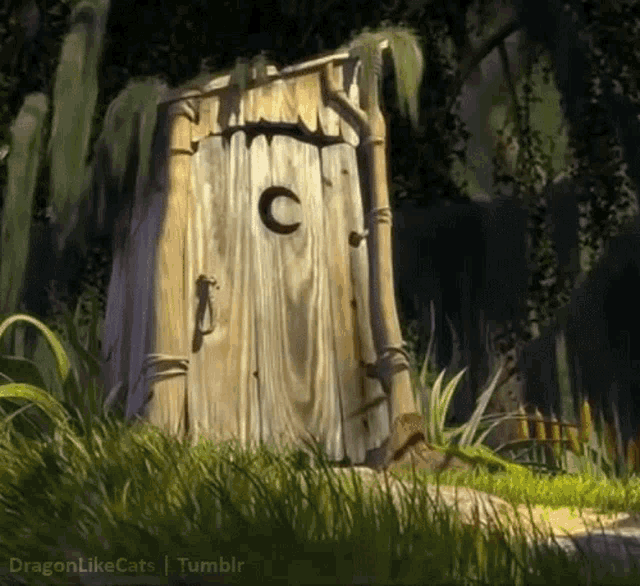 a wooden toilet with the letter c on the door