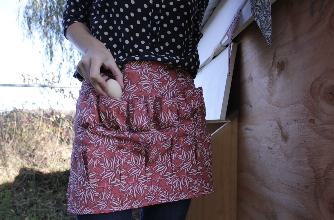 studio-cluck-egg-apron-red-wild-print.png